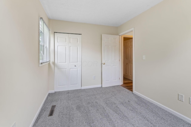 893 Aladdin Ct, Columbus, OH 43207 - unfurnished bedroom featuring carpet floors and a closet