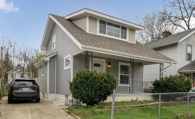 1555 Myrtle Ave, Columbus, OH 43211 - view of front of property featuring covered porch, a shingled roof, and concrete driveway