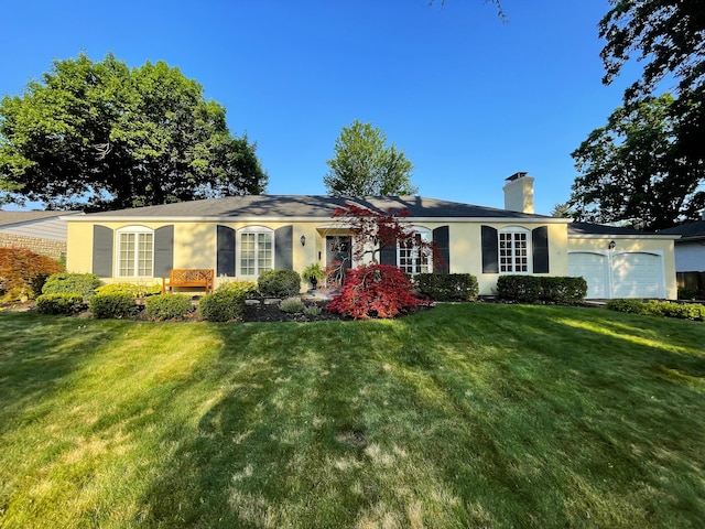 3169 Halesworth Rd, Columbus, OH 43221 - ranch-style home with an attached garage, a chimney, a front lawn, and stucco siding