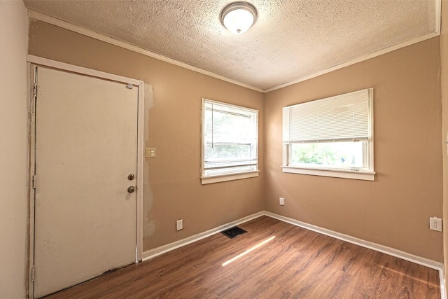 330 S Harris Ave, Columbus, OH 43204 - unfurnished room featuring a textured ceiling, wood finished floors, and crown molding