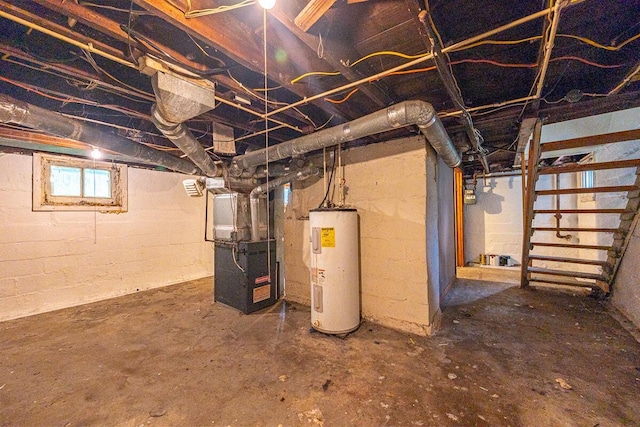 330 S Harris Ave, Columbus, OH 43204 - basement featuring electric water heater, heating unit, and stairway