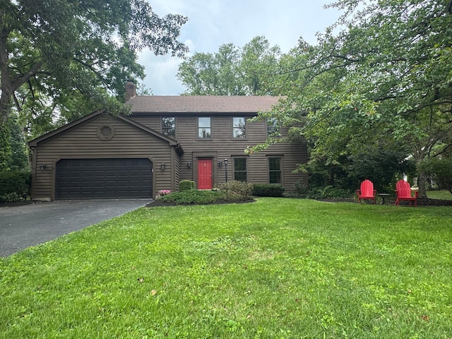 1100 Riva Ridge Blvd, Columbus, OH 43230 - colonial home featuring asphalt driveway, a garage, a front yard, and a chimney