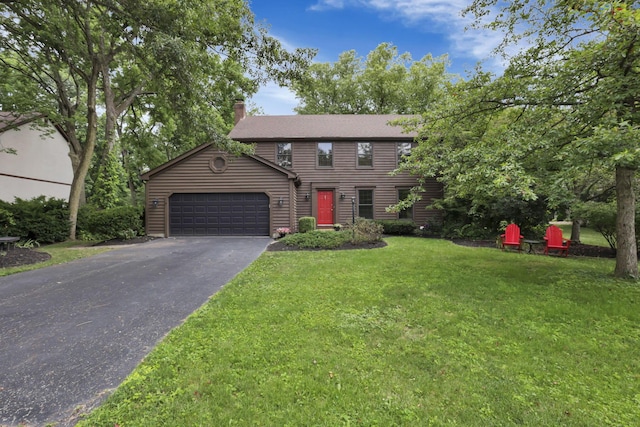 1100 Riva Ridge Blvd, Columbus, OH 43230 - colonial house with driveway, a garage, a chimney, and a front lawn