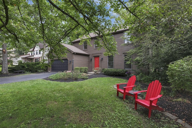 1100 Riva Ridge Blvd, Columbus, OH 43230 - view of front of property with an attached garage, asphalt driveway, and a front yard