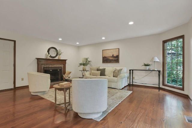 1100 Riva Ridge Blvd, Columbus, OH 43230 - living room with a brick fireplace, dark wood-type flooring, and recessed lighting
