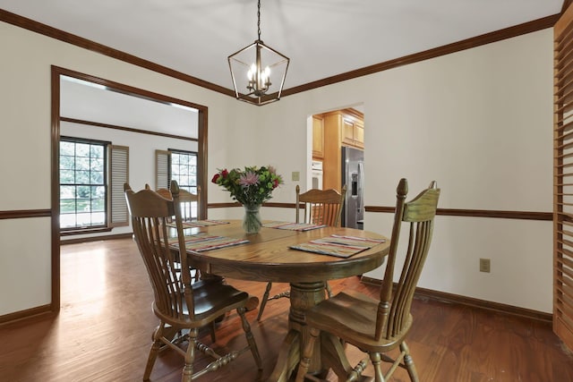 1100 Riva Ridge Blvd, Columbus, OH 43230 - dining area featuring a chandelier, dark wood-style flooring, and crown molding