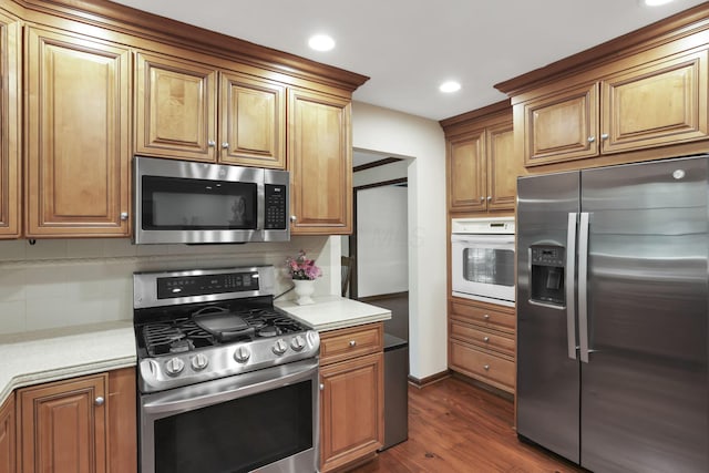 1100 Riva Ridge Blvd, Columbus, OH 43230 - kitchen with appliances with stainless steel finishes, dark wood-style floors, light countertops, tasteful backsplash, and recessed lighting