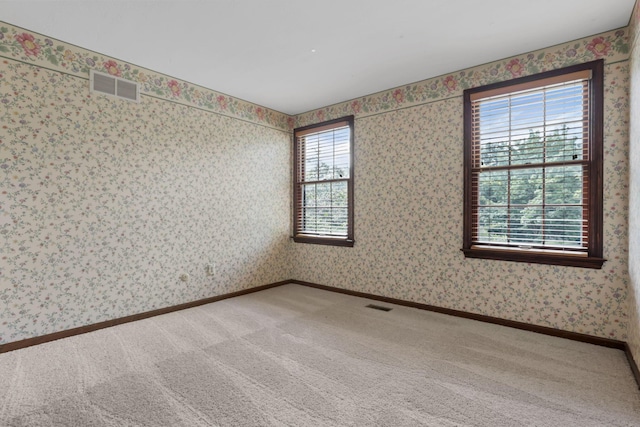 1100 Riva Ridge Blvd, Columbus, OH 43230 - carpeted empty room with wallpapered walls and baseboards