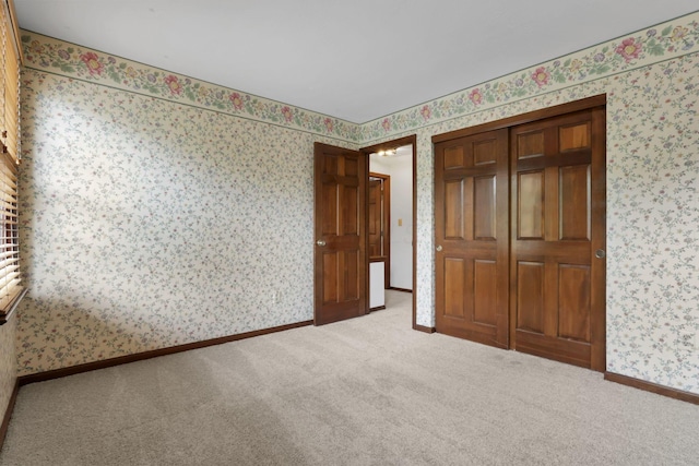 1100 Riva Ridge Blvd, Columbus, OH 43230 - unfurnished bedroom with wallpapered walls, carpet floors, and a closet