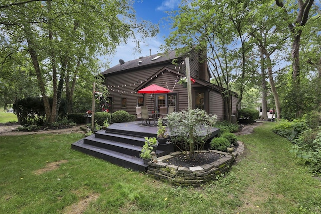 1100 Riva Ridge Blvd, Columbus, OH 43230 - back of property with a deck, a lawn, and outdoor dining space
