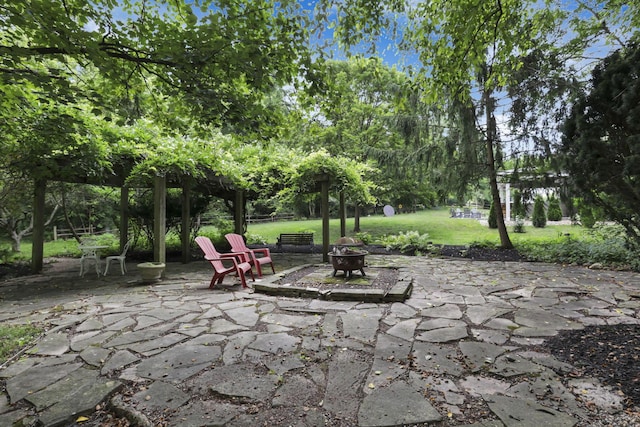 1100 Riva Ridge Blvd, Columbus, OH 43230 - view of patio / terrace with an outdoor fire pit and view of scattered trees
