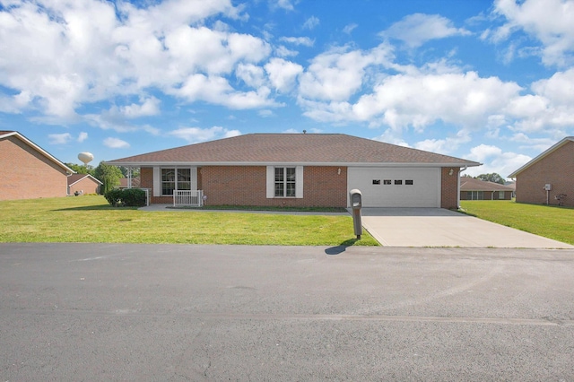 406 Aarika Dr, West Jefferson, OH 43162 - single story home with a garage, driveway, a front lawn, and brick siding