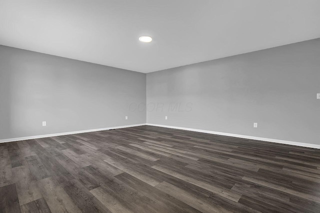 406 Aarika Dr, West Jefferson, OH 43162 - empty room with dark wood-style flooring and recessed lighting