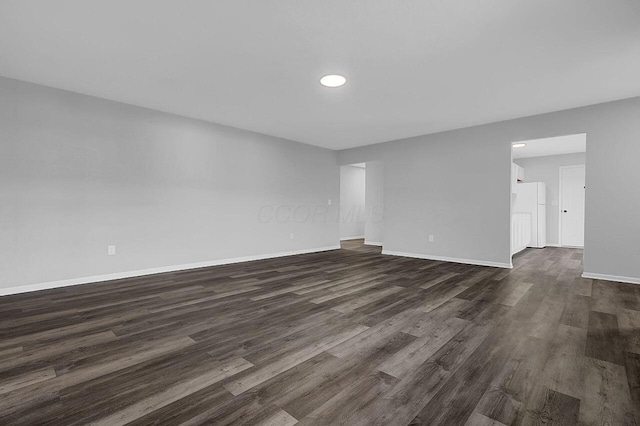 406 Aarika Dr, West Jefferson, OH 43162 - empty room featuring dark wood finished floors and recessed lighting
