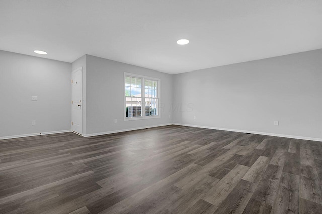 406 Aarika Dr, West Jefferson, OH 43162 - empty room with dark wood-style flooring and recessed lighting