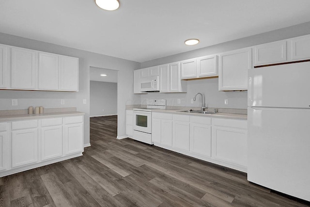 406 Aarika Dr, West Jefferson, OH 43162 - kitchen with white appliances, light countertops, dark wood-type flooring, white cabinetry, and recessed lighting