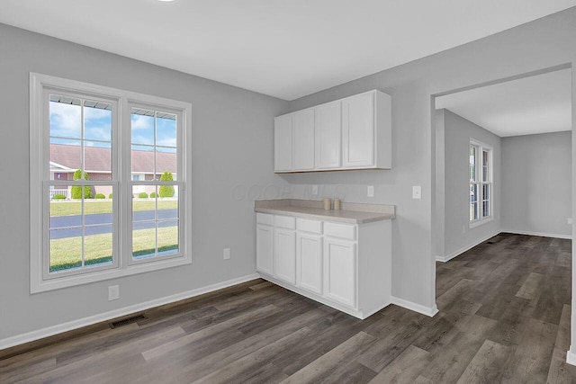 406 Aarika Dr, West Jefferson, OH 43162 - kitchen with dark wood finished floors, light countertops, and white cabinets