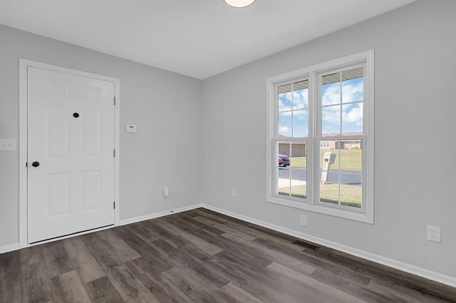 406 Aarika Dr, West Jefferson, OH 43162 - spare room with dark wood-type flooring