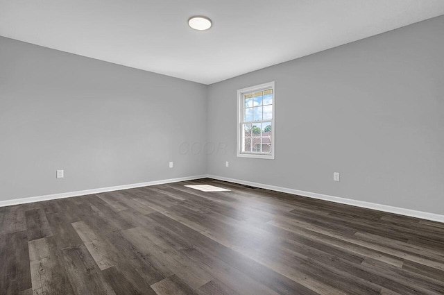 406 Aarika Dr, West Jefferson, OH 43162 - spare room with dark wood-type flooring