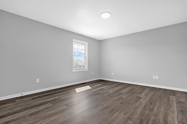 406 Aarika Dr, West Jefferson, OH 43162 - unfurnished room featuring dark wood finished floors and baseboards