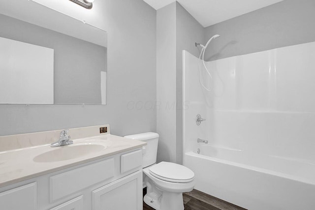 406 Aarika Dr, West Jefferson, OH 43162 - bathroom featuring vanity, wood finished floors, and bathing tub / shower combination