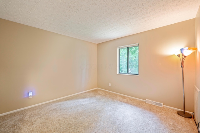 3033 Highcliff Ct, Columbus, OH 43231 - carpeted empty room featuring a textured ceiling and baseboards