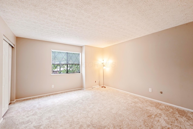 3033 Highcliff Ct, Columbus, OH 43231 - unfurnished bedroom with carpet floors, a closet, and a textured ceiling