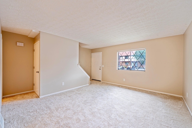 3033 Highcliff Ct, Columbus, OH 43231 - carpeted empty room with a textured ceiling and baseboards