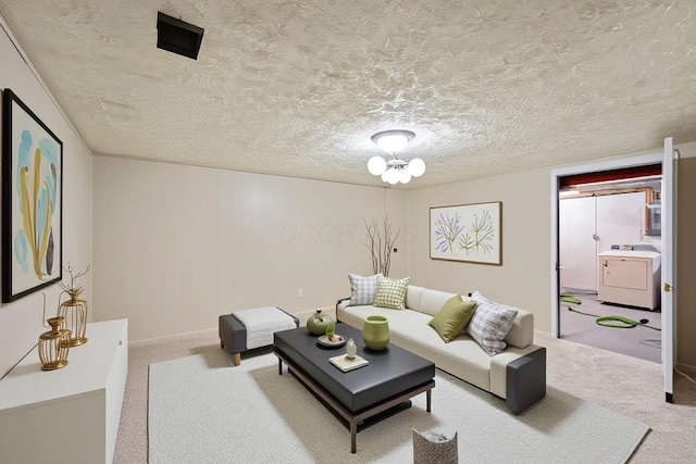 3033 Highcliff Ct, Columbus, OH 43231 - living room featuring washer / dryer, carpet, and a textured ceiling