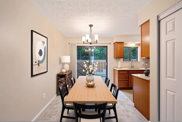 3033 Highcliff Ct, Columbus, OH 43231 - dining area with a chandelier, light carpet, and a textured ceiling