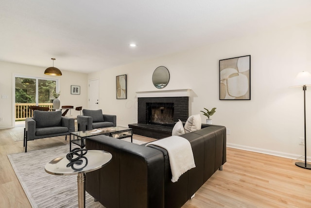 13900 Justin Rd, Utica, OH 43080 - living area featuring light wood-style floors and a fireplace