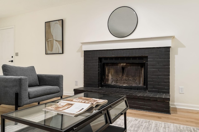 13900 Justin Rd, Utica, OH 43080 - living room with wood finished floors and a brick fireplace