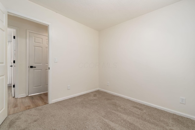 13900 Justin Rd, Utica, OH 43080 - spare room featuring carpet and baseboards