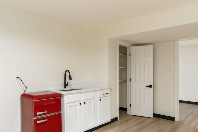 13900 Justin Rd, Utica, OH 43080 - bar with a sink and light wood-style flooring