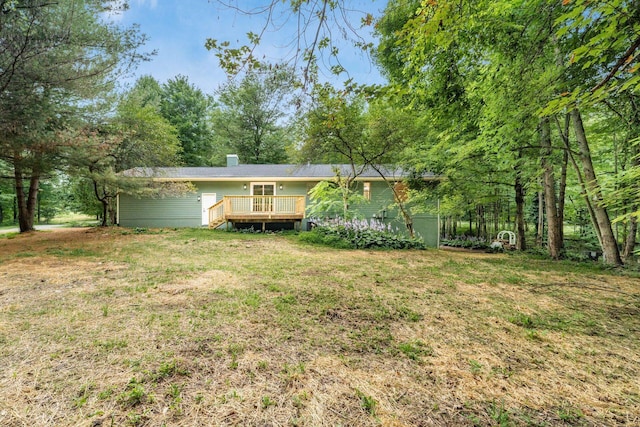 13900 Justin Rd, Utica, OH 43080 - view of front of home with a deck, a front lawn, and a chimney
