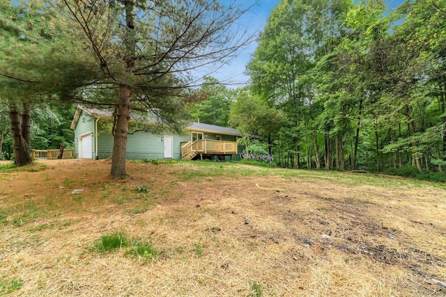 13900 Justin Rd, Utica, OH 43080 - view of yard with a garage and a wooden deck