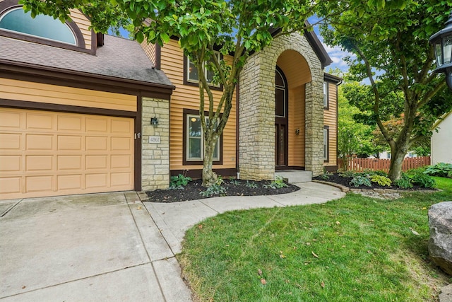 4867 Sarasota Ct, Hilliard, OH 43026 - view of front facade featuring stone siding, concrete driveway, and a shingled roof