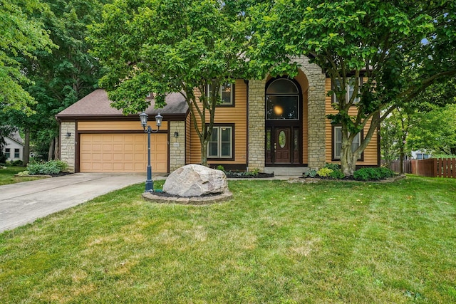 4867 Sarasota Ct, Hilliard, OH 43026 - view of front facade featuring stone siding, a garage, and driveway