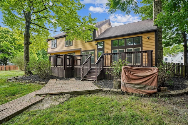 4867 Sarasota Ct, Hilliard, OH 43026 - back of property with a wooden deck and a chimney