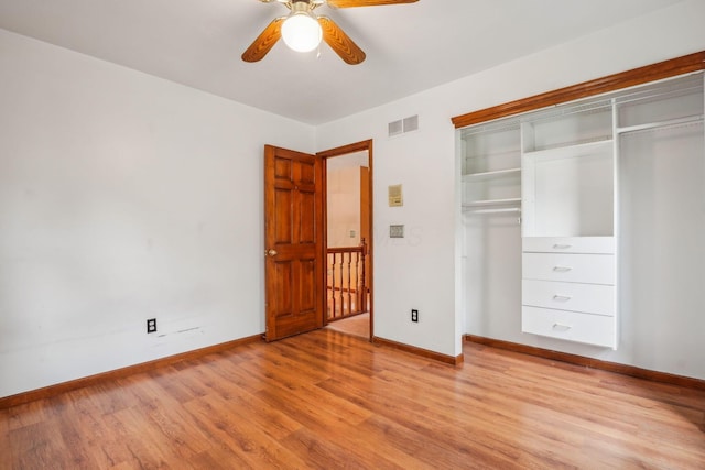 4867 Sarasota Ct, Hilliard, OH 43026 - unfurnished bedroom with light wood-style floors, a closet, and a ceiling fan