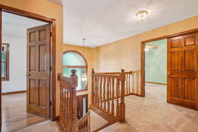 4867 Sarasota Ct, Hilliard, OH 43026 - hall featuring an upstairs landing and carpet flooring