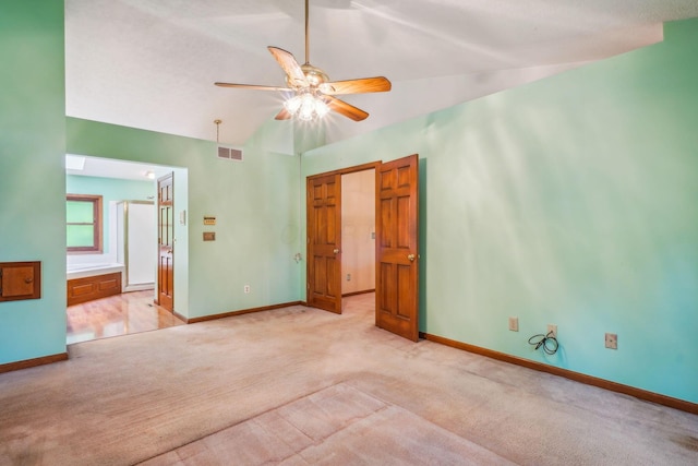 4867 Sarasota Ct, Hilliard, OH 43026 - unfurnished bedroom with light colored carpet, vaulted ceiling, connected bathroom, and a ceiling fan