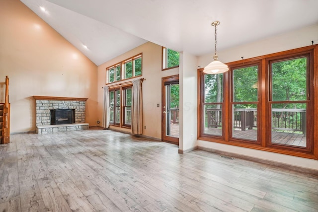 4867 Sarasota Ct, Hilliard, OH 43026 - unfurnished living room with wood-type flooring, high vaulted ceiling, and a fireplace
