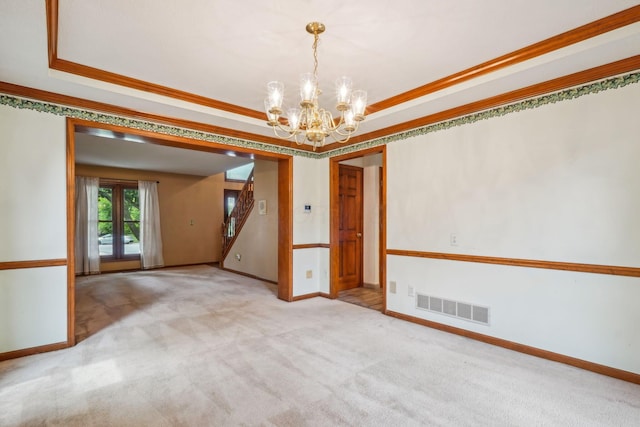 4867 Sarasota Ct, Hilliard, OH 43026 - carpeted spare room featuring a chandelier, crown molding, a tray ceiling, and stairs