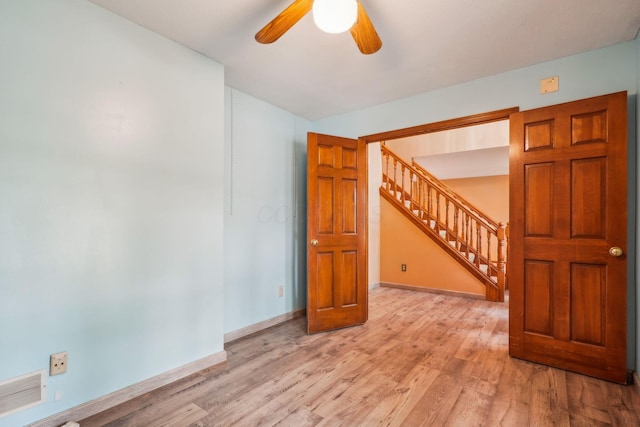 4867 Sarasota Ct, Hilliard, OH 43026 - spare room with ceiling fan, stairs, and light wood-type flooring