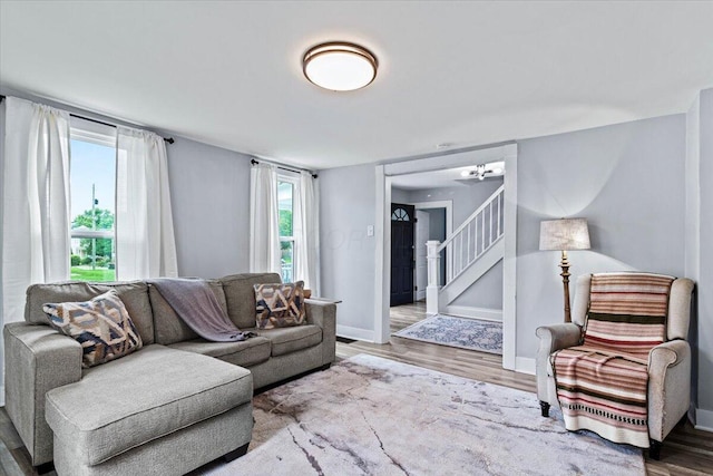 114 N 7th St, Newark, OH 43055 - living room featuring wood finished floors, plenty of natural light, and stairs
