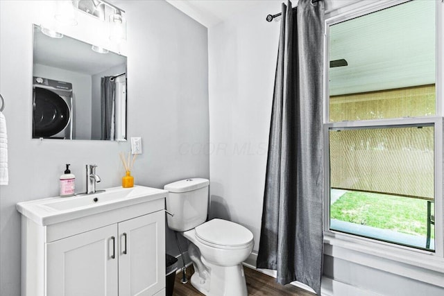 114 N 7th St, Newark, OH 43055 - bathroom with washer / dryer, wood finished floors, and vanity