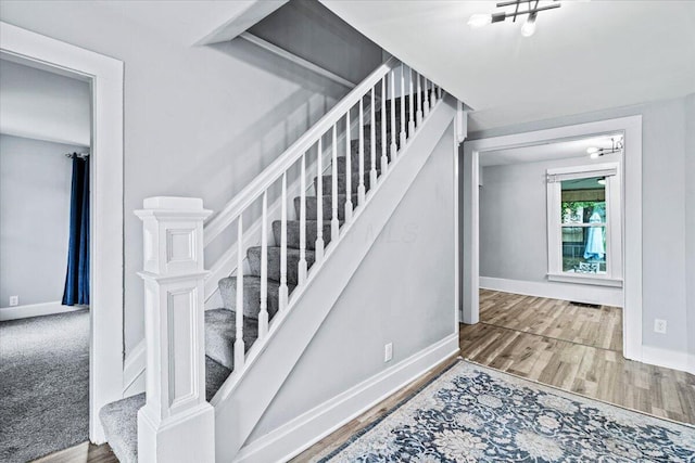 114 N 7th St, Newark, OH 43055 - stairs with baseboards and wood finished floors
