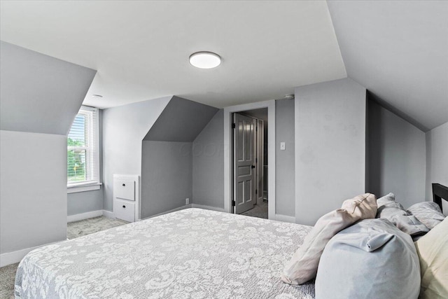 114 N 7th St, Newark, OH 43055 - carpeted bedroom with lofted ceiling and baseboards