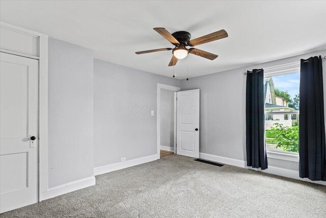 114 N 7th St, Newark, OH 43055 - unfurnished bedroom with carpet flooring and ceiling fan